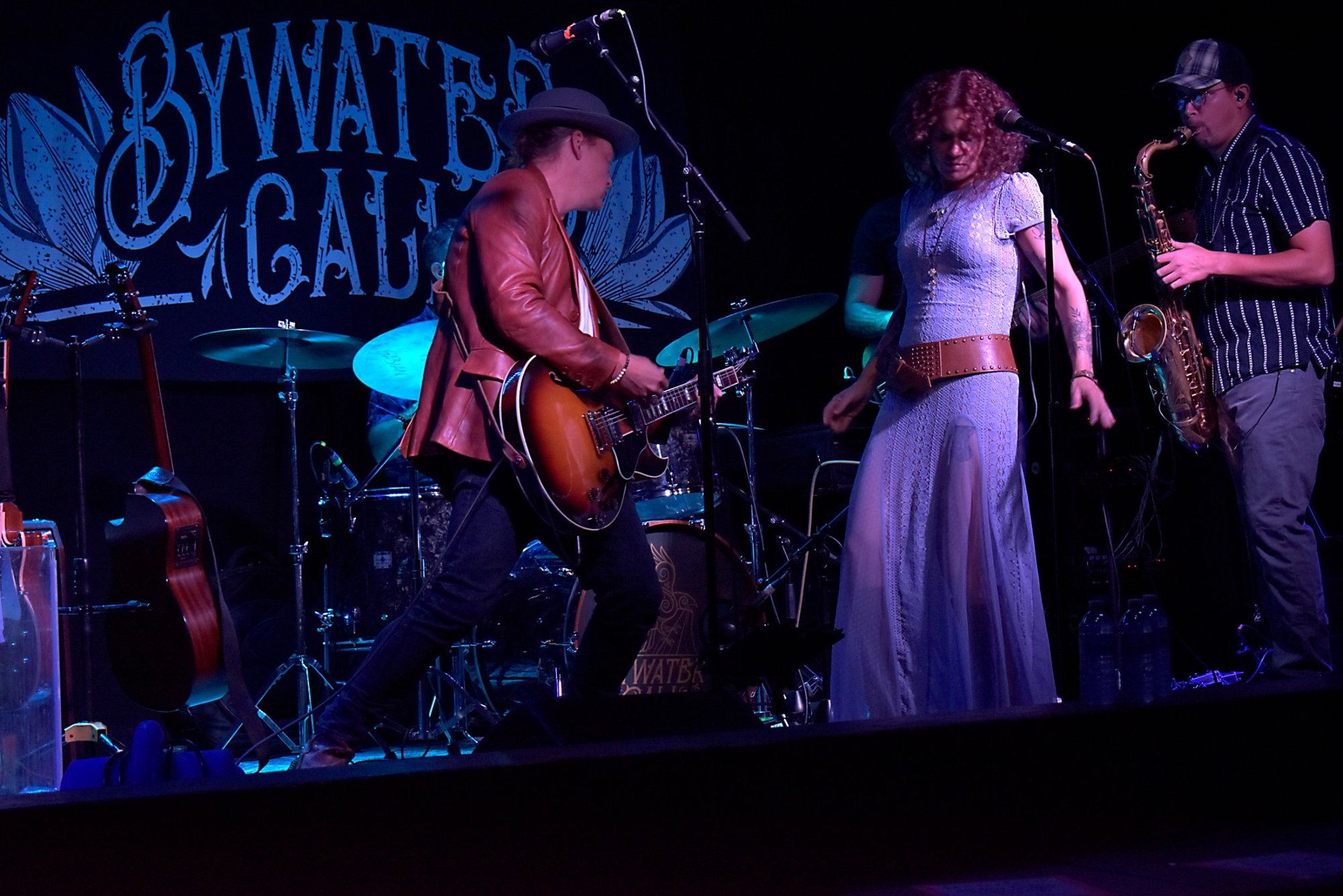 Attack of the killer guitarist, can the saxophonist save her in time?